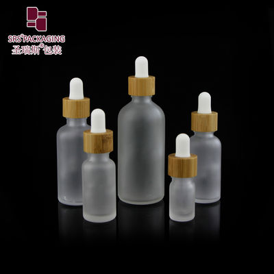 خرید Custom Frosted Essential Oil Empty Packaging 15ml 30ml 50ml 100ml Bamboo Dropper Bottle تولید آنلاین